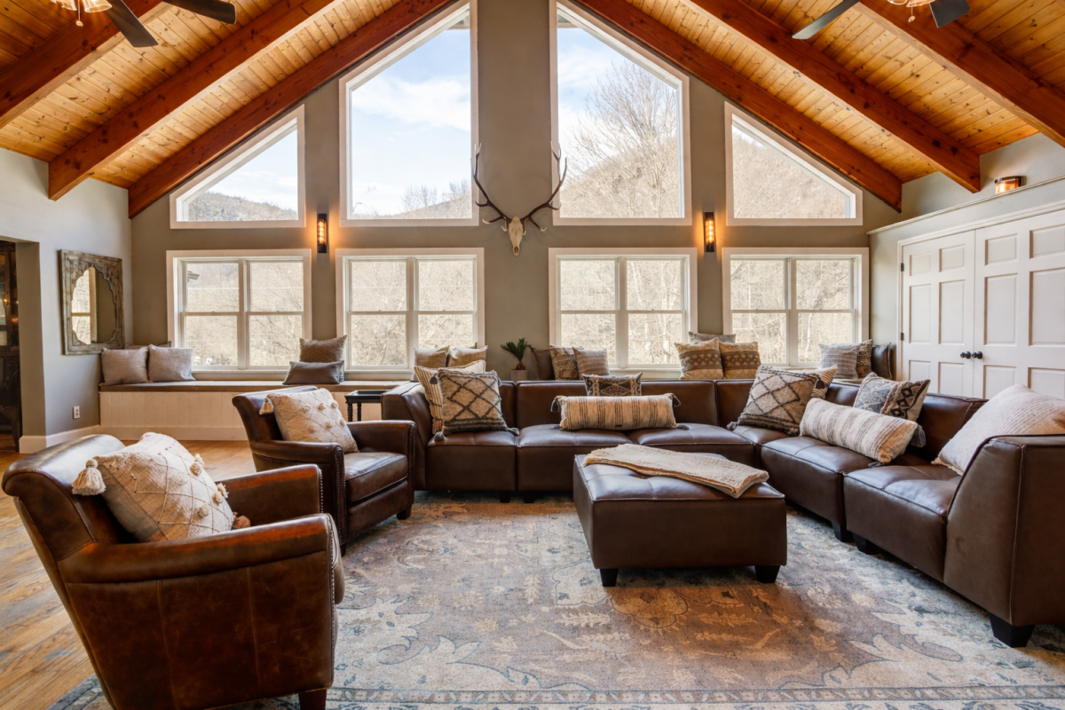 Main Lodge living room with cathedral ceilings and mountain views