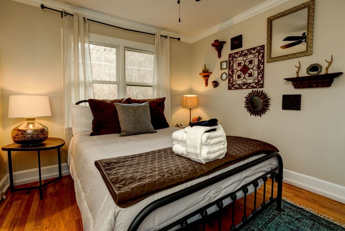 Warm bedroom lit at dusk