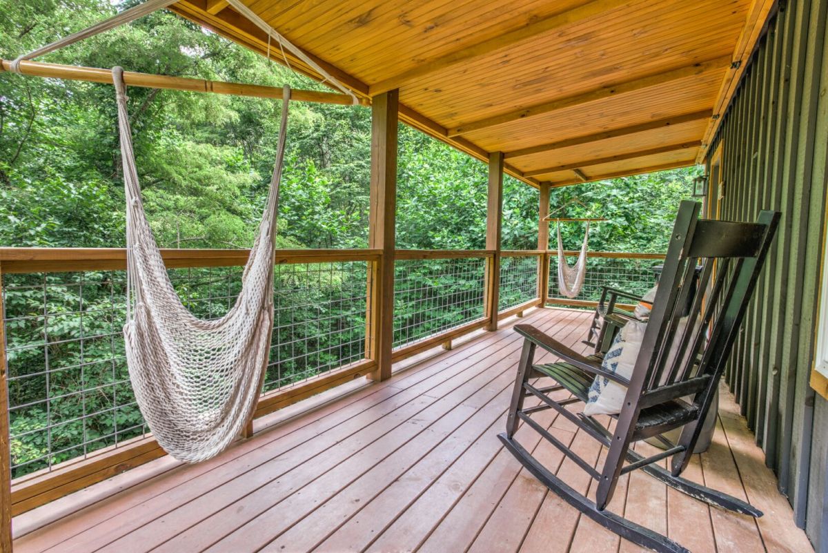 Wooded cabin porch with hammock